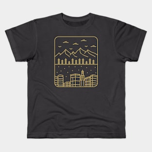 mountains and urban buildings Kids T-Shirt